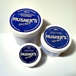 Musher's Secret, a popular paw wax developed in Canada for sled dogs.