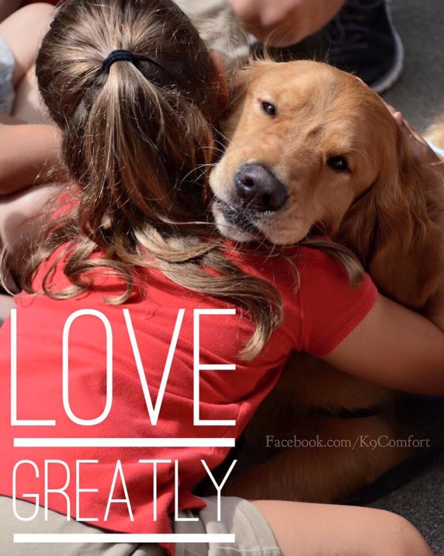 Love Greatly - Golden Retriever hugs woman - photo via KCC K-9 Comfort Dogs Facebook page