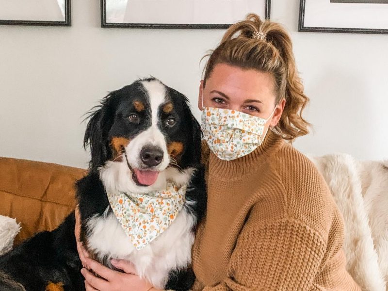 Bernese Mountain dog and woman wearing matching bandanna mask set